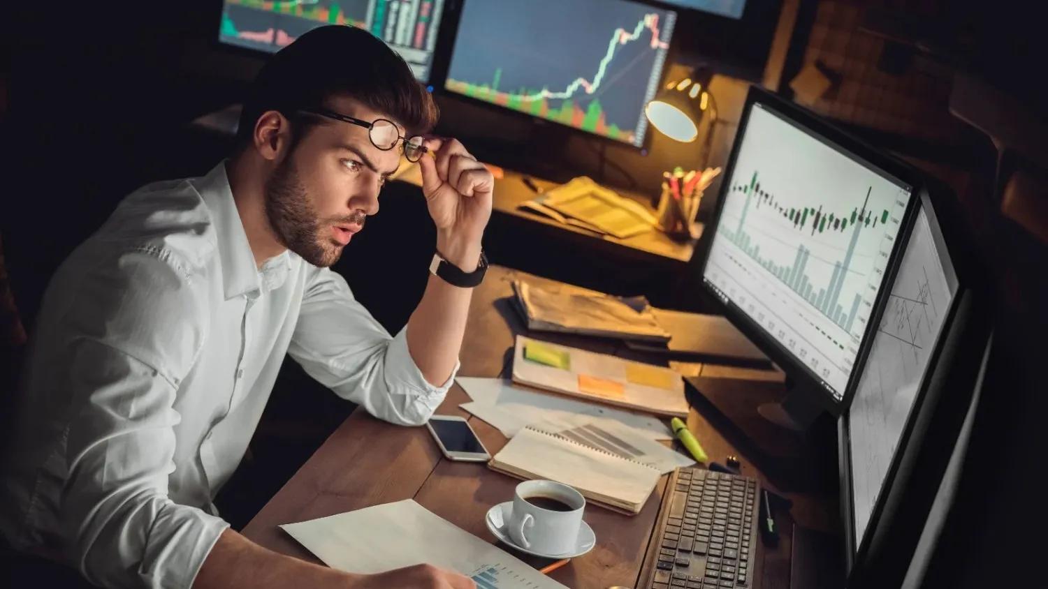 Focused trader analyzing forex market charts.